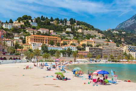 MENTON, FRANCE - JUNE 13, 2016: Colorful old town and beach in Menton on french Riviera in a beautiful 

summer day, France on June 13, 2016のeditorial素材