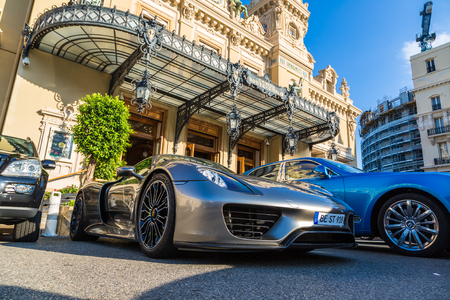 MONTE CARLO, MONACO - JUNE 15, 2016: Luxury cars next to the grand casino in Monte Carlo in a beautiful summer day, Monaco on June 15, 2016のeditorial素材