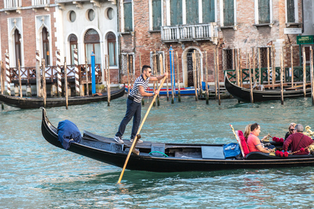 VENICE, ITALY - JUNE 18, 2014: Gondola on Canal Grande in Venice, in a beautiful summer day in Italy on June 18のeditorial素材