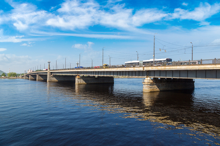 Stone bridge over Daugava river in Riga in a beautiful summer day, Latviaのeditorial素材