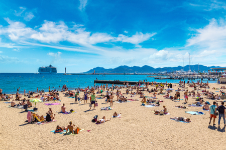 CANNES, FRANCE - JUNE 23, 2016: People on popular beach in Cannes in a beautiful summer day, France on June 23, 2016のeditorial素材