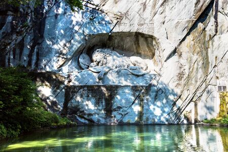 Dying lion monument in Lucerne in a beautiful summer day, Switzerlandの写真素材