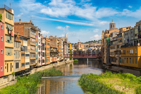 Colorful houses, Eiffel bridge and Saint Mary Cathedral at background in Girona, in a beautiful summer day, Catalonia, Spainのeditorial素材