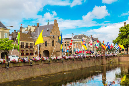 Lake Hofvijver with flags near Binnenhof palace in 

Hague in a beautiful summer day, The Netherlandsのeditorial素材