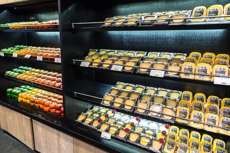 AMSTERDAM, THE NETHERLANDS - JUNE 16, 2016: Cheese wheels on the shelves in Amsterdam store, The Netherlands on June 16, 2016のeditorial素材