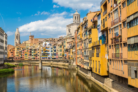 Colorful houses and Saint Mary Cathedral at background in Girona, in a beautiful summer day, Catalonia, Spainの写真素材