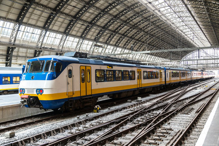 Central train station in Amsterdam in a beautiful summer day, The Netherlandsの写真素材
