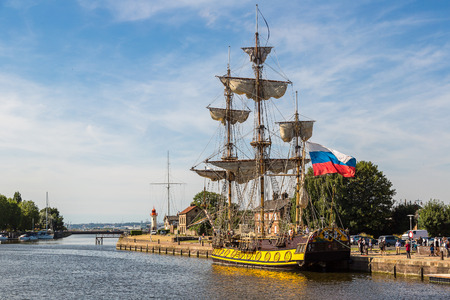 Wooden sailing ship in Honfleur Harbor in a beautiful summer day, Franceの写真素材