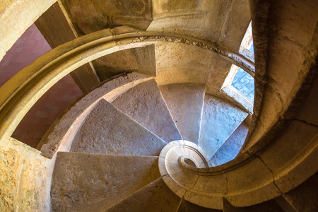 Spiral staircase in medieval Templar castle in Tomar in a beautiful summer day, Portugalのeditorial素材
