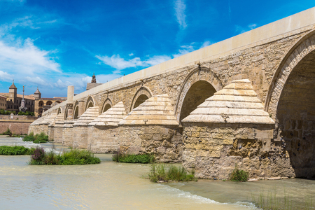 Roman Bridge on Guadalquivir river in Cordoba in a beautiful summer day, Spainの写真素材