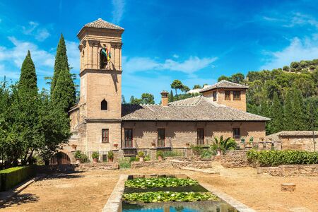 Garden and Bell Tower in Alhambra palace in Granada in a beautiful summer day, Spainのeditorial素材
