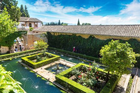 Gardens and fountains in Alhambra palace in Granada in a beautiful summer day, Spainのeditorial素材