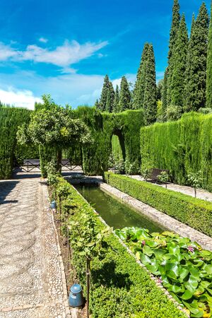 Gardens and fountains in Alhambra palace in Granada in a beautiful summer day, Spainのeditorial素材