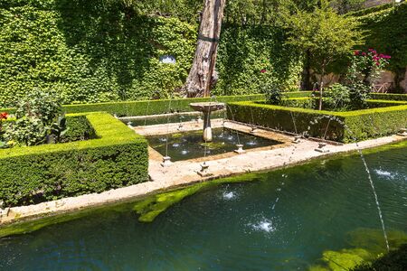 Gardens and fountains in Alhambra palace in Granada in a beautiful summer day, Spainのeditorial素材