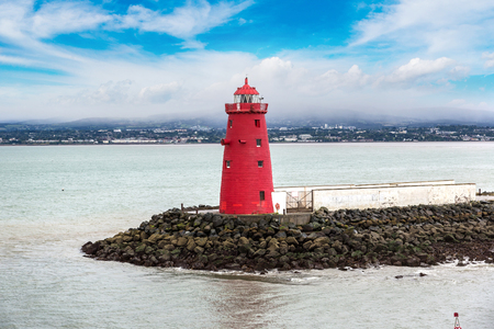 Red lighthouse in Dublinin port in a beautiful summer day, Irelandの写真素材