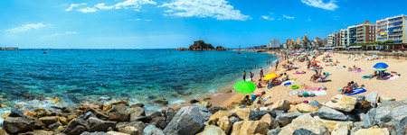 BLANES, SPAIN - JUNE 26, 2016: Tourists enjoy at the beach in Blanes in Costa Brava in a beautiful summer day, Spain on June 26, 2016のeditorial素材