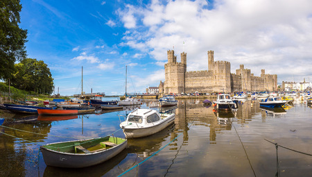 Caernarfon Castle in Wales in a beautiful summer day, United Kingdomの写真素材