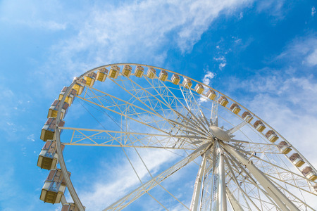 Ferris wheel on blue sky background in a beautiful summer dayの写真素材