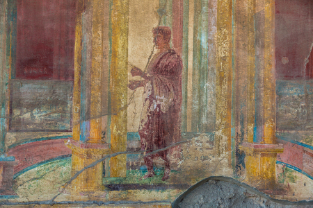 Painted wall in Pompeii city destroyed in 79BC by the eruption of volcano Vesuvius, Italy in a beautiful summer dayのeditorial素材