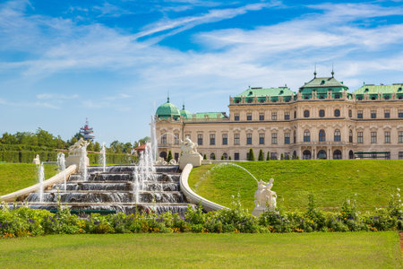 Fountain and Belvedere Palace in Vienna, Austria in a beautiful summer dayのeditorial素材