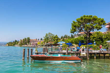 SIRMIONE, ITALY - JUNE 16, 2016: Sirmione on lake Garda in a beautiful summer day, Italy on June 16, 2016のeditorial素材