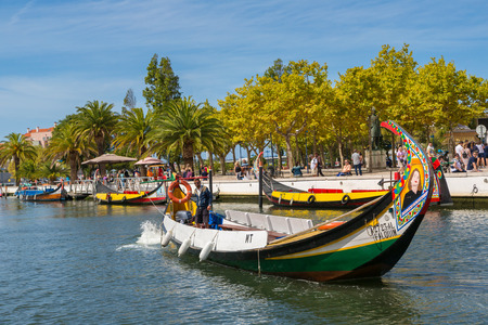 AVEIRO, PORTUGAL - JULY 25, 2017: Traditional boats on main city canal in Aveiro, Portugal in a beautiful summer dayのeditorial素材
