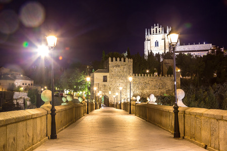 Bridge San Martin in Toledo, Spain in a beautiful summer nightの写真素材