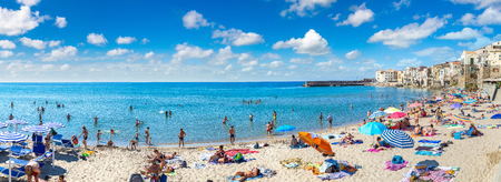 CEFALU, ITALY - JULY 28, 2017: Sandy beach in Cefalu in Sicily, Italy in a beautiful summer dayのeditorial素材