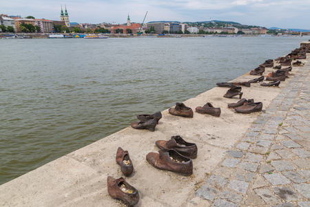 BUDAPEST, HUNGARY - JULY 22, 2017: Shoes symbolizing the massacre of people shot at the river Danube during World War 2 in Budapest in Hungary in a beautiful summer dayのeditorial素材