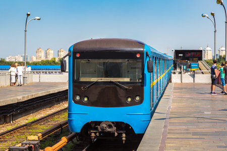 Metro (subway) train on metro bridge in Kiev, Ukraine in a beautiful summer day