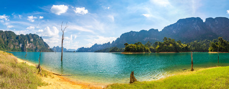 Panorama of Beautiful nature at Cheow Lan lake, Ratchaprapha Dam, Khao Sok National Park in Thailand in a summer dayの写真素材