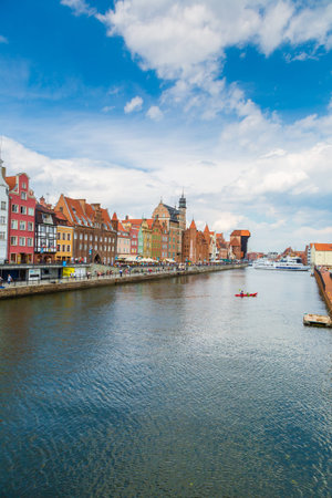 GDANSK, POLAND - JUNE 9, 2014: Tourist ship and colourful historic houses reflection Motlawa river...