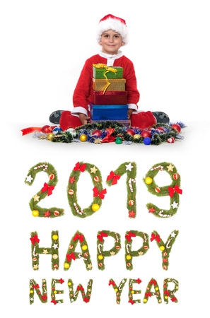 Boy holding a christmas box gift isolated on white background. 2019 New Year greetingの写真素材