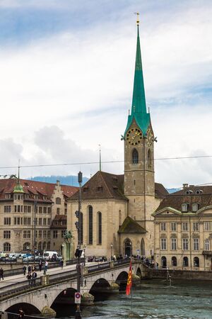ZURICH, SWITZERLAND - JUNE 27, 2016: Clock tower of the Fraumunster Cathedral in historical part of Zurich in a beautiful summer day, Switzerlandのeditorial素材