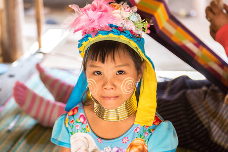 CHIANG RAI, THAILAND - MARCH 29, 2018: Portrait of a long neck little girl in a village near Chiang Rai, Thailand in a summer dayのeditorial素材
