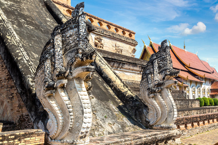 Ancient pagoda at Wat Chedi Luang temple in Chiang Mai, Thailand in a summer dayの写真素材