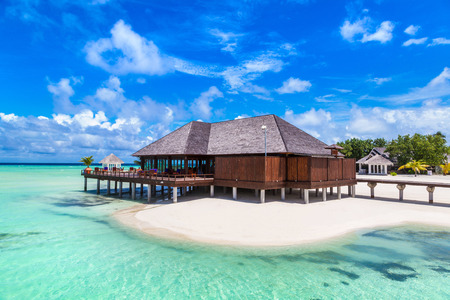 MALDIVES - JUNE 24, 2018: Water Villas (Bungalows) and wooden bridge at Tropical beach in the Maldives at summer dayのeditorial素材