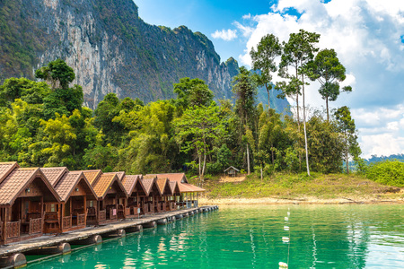 Traditional Thai bungalows at Cheow Lan lake, Ratchaprapha Dam, Khao Sok National Park in Thailand in a summer dayのeditorial素材