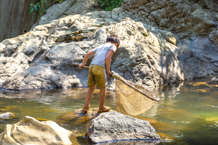 Boy fishing at the river in Sapa, Lao Cai, Vietnam in a summer dayのeditorial素材