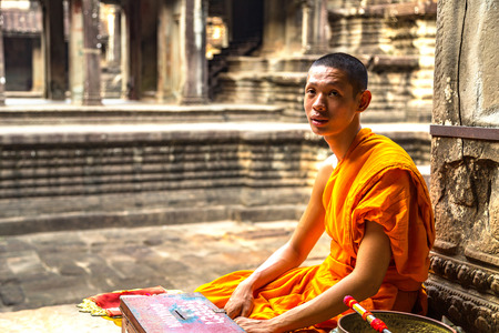 SIEM REAP, CAMBODIA - JUNE 11, 2018: Buddhist monk in Angkor Wat temple in Siem Reap, Cambodia in a summer dayのeditorial素材