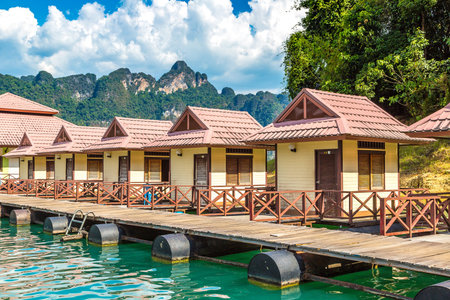 Traditional Thai bungalows at Cheow Lan lake, Ratchaprapha Dam, Khao Sok National Park in Thailand...