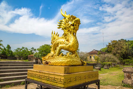 Golden dragon statue located inside Imperial Royal Palace, Forbidden city in Hue, Vietnam in a summer dayのeditorial素材