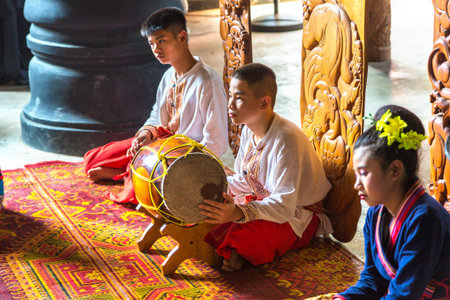 CHIANG RAI, THAILAND - MARCH 29, 2018: Musician in Baan Dam Museum (Black Temple) in Chiang Rai,...