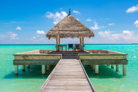 MALDIVES - JUNE 24, 2018: Water Villas (Bungalows) and wooden bridge at Tropical beach in the Maldives at summer dayのeditorial素材