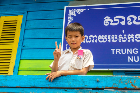 CHONG KHNEAS, CAMBODIA - JUNE 11, 2018: Cambodian student in floating school in Chong Khneas floating village near Siem Reap, Cambodiaのeditorial素材