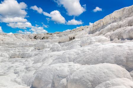 Travertine pools and terraces in Pamukkale, Turkey in a beautiful summer dayの写真素材