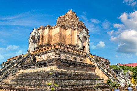Ancient pagoda at Wat Chedi Luang temple in Chiang Mai, Thailand in a summer dayの写真素材