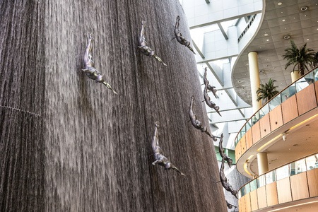 DUBAI, UAE - JUNE 26, 2018: Waterfall in Dubai Mall, United Arab Emiratesのeditorial素材