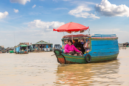 CHONG KHNEAS, CAMBODIA - JUNE 11, 2018: Women Selling vegetable and fruit in a boat in Chong Khneas floating village near Siem Reap, Cambodiaのeditorial素材