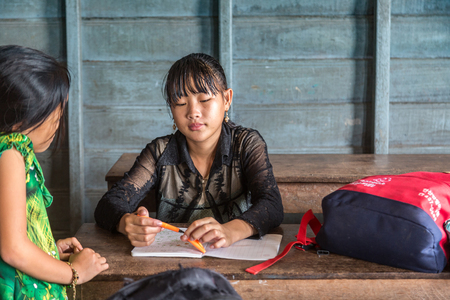 CHONG KHNEAS, CAMBODIA - JUNE 11, 2018: Cambodian students in floating school in Chong Khneas floating village near Siem Reap, Cambodiaのeditorial素材